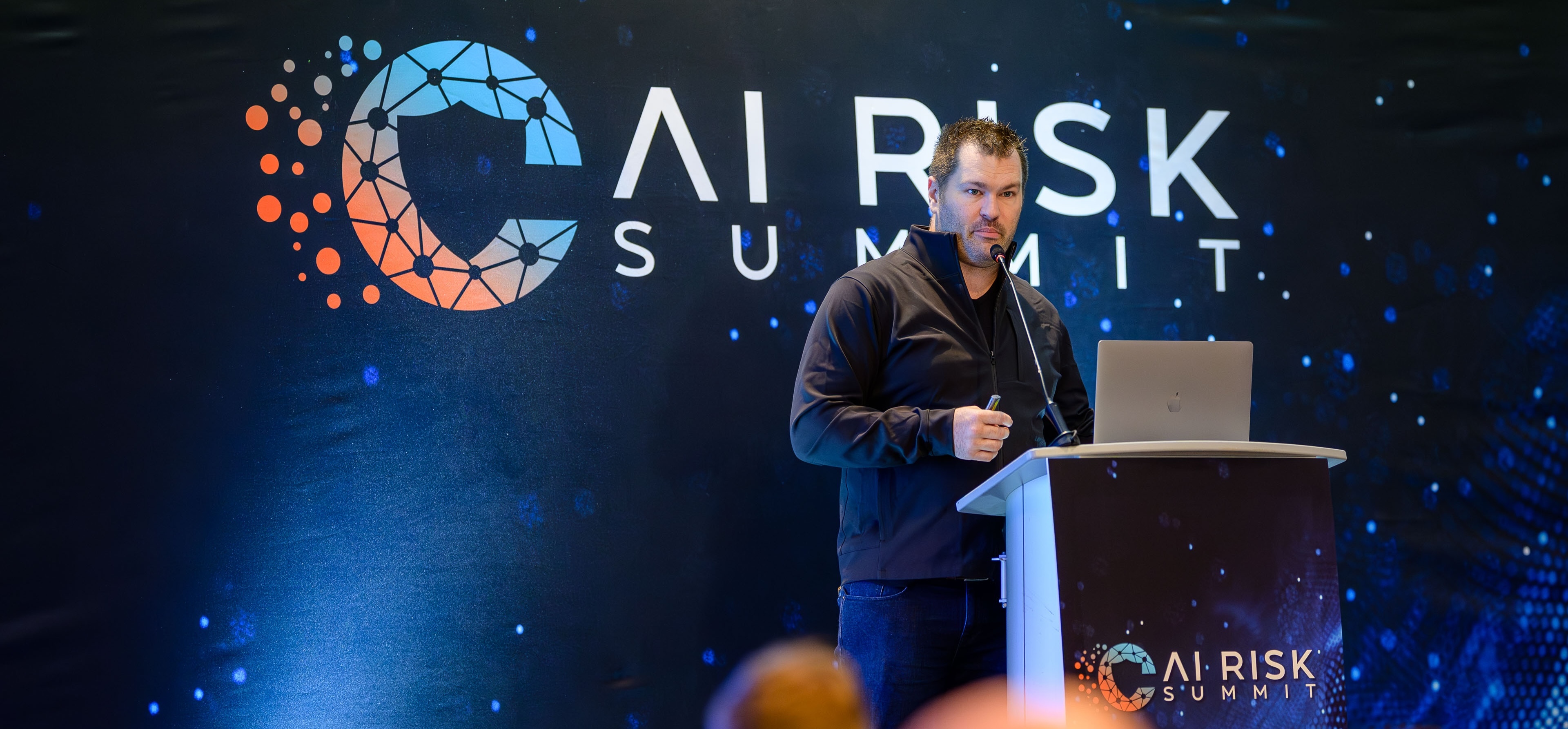 David Campbell delivering keynote at AI Risk Summit 2025